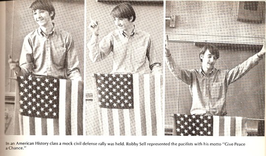 In an American History class, a mock civil defense rally was held. Robby Sell represented the pacifists with his motto, "Give peace a chance!"
